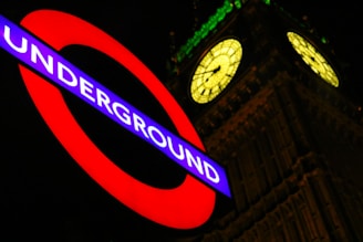 Underground neon signage beside Big Ben