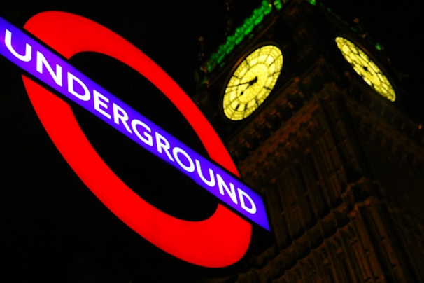 Underground neon signage beside Big Ben