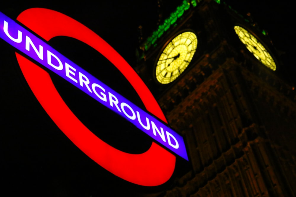 Underground neon signage beside Big Ben