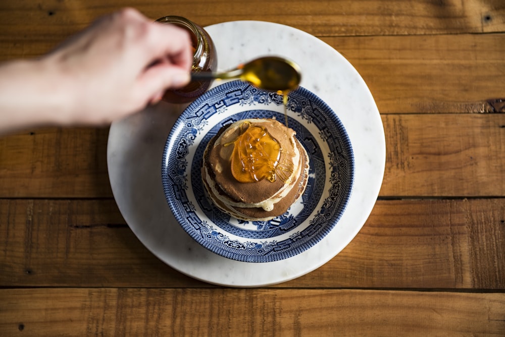 cupcake on round blue and white plate