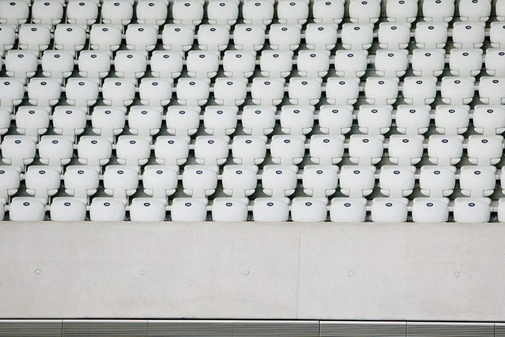 white seats with gray concrete platform