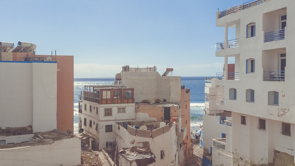 aerial photography of white and brown concrete buildings near ocean