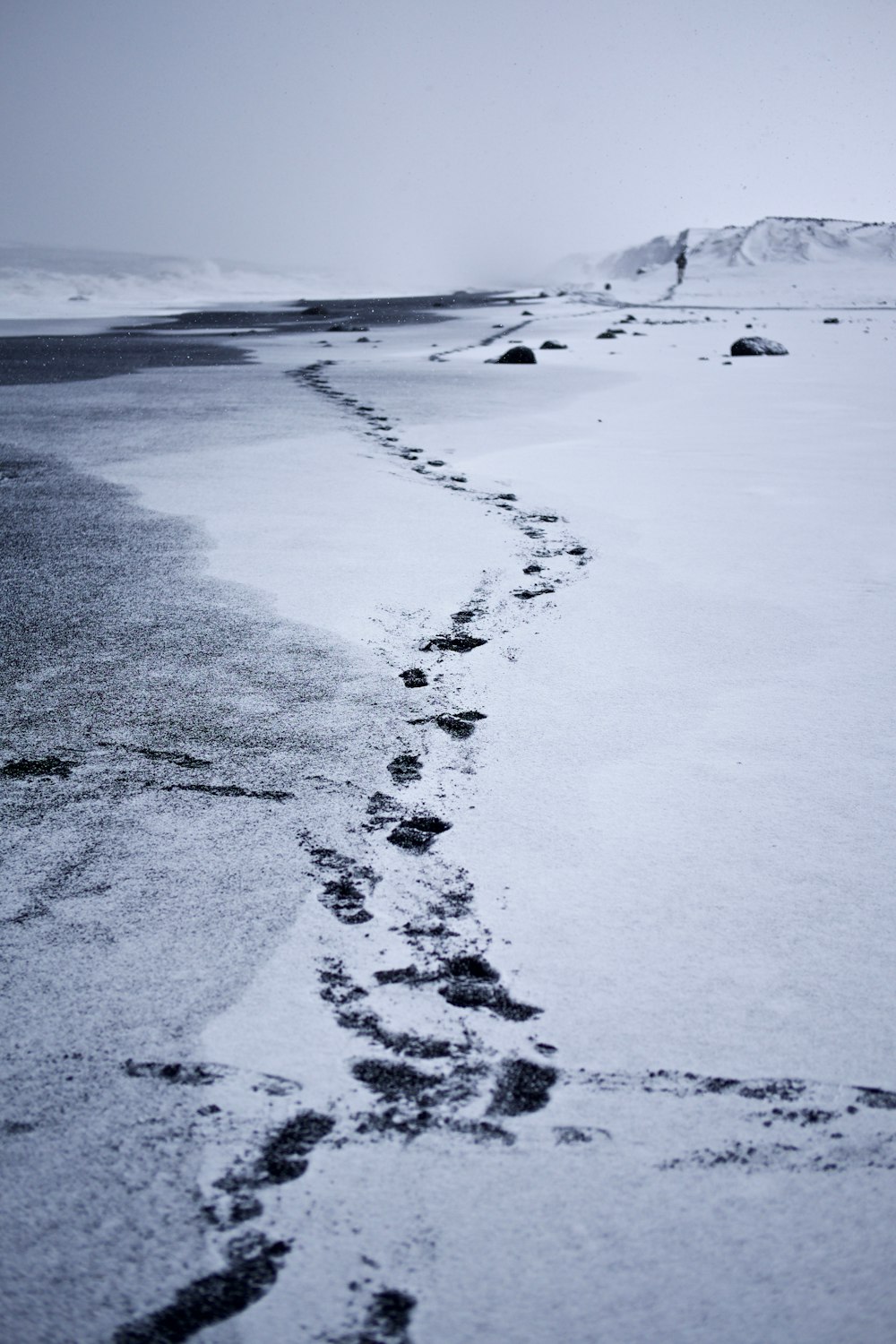 photography of feet print on through mountain