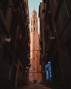 people standing between building
