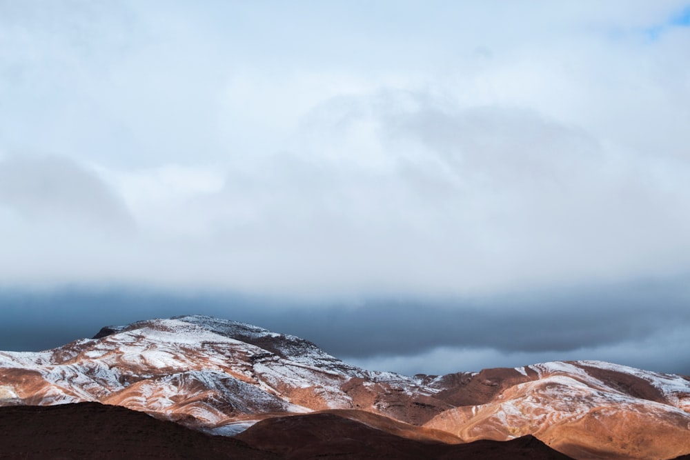 landscape photography of brown and white mountains
