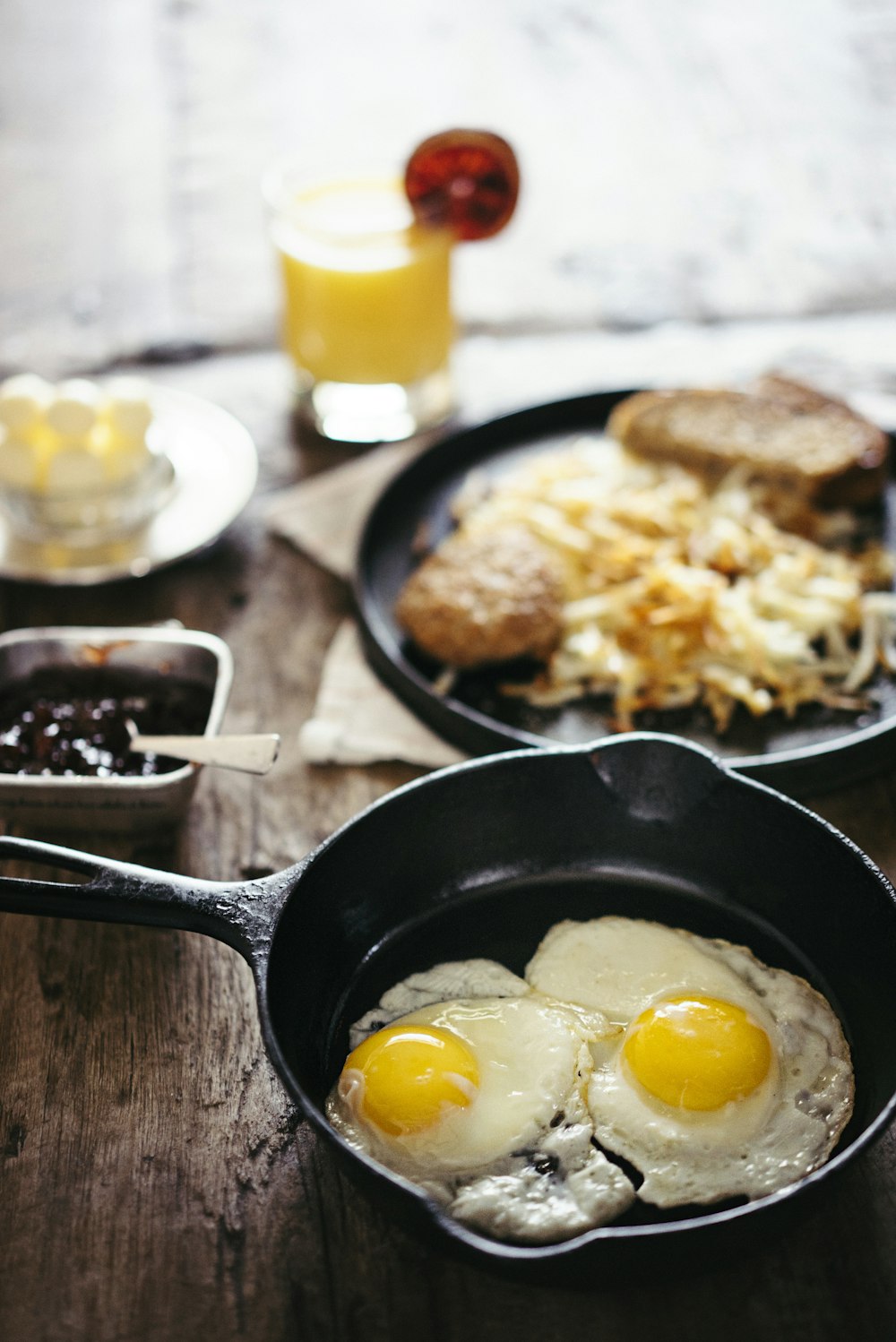 two fried eggs on skillet