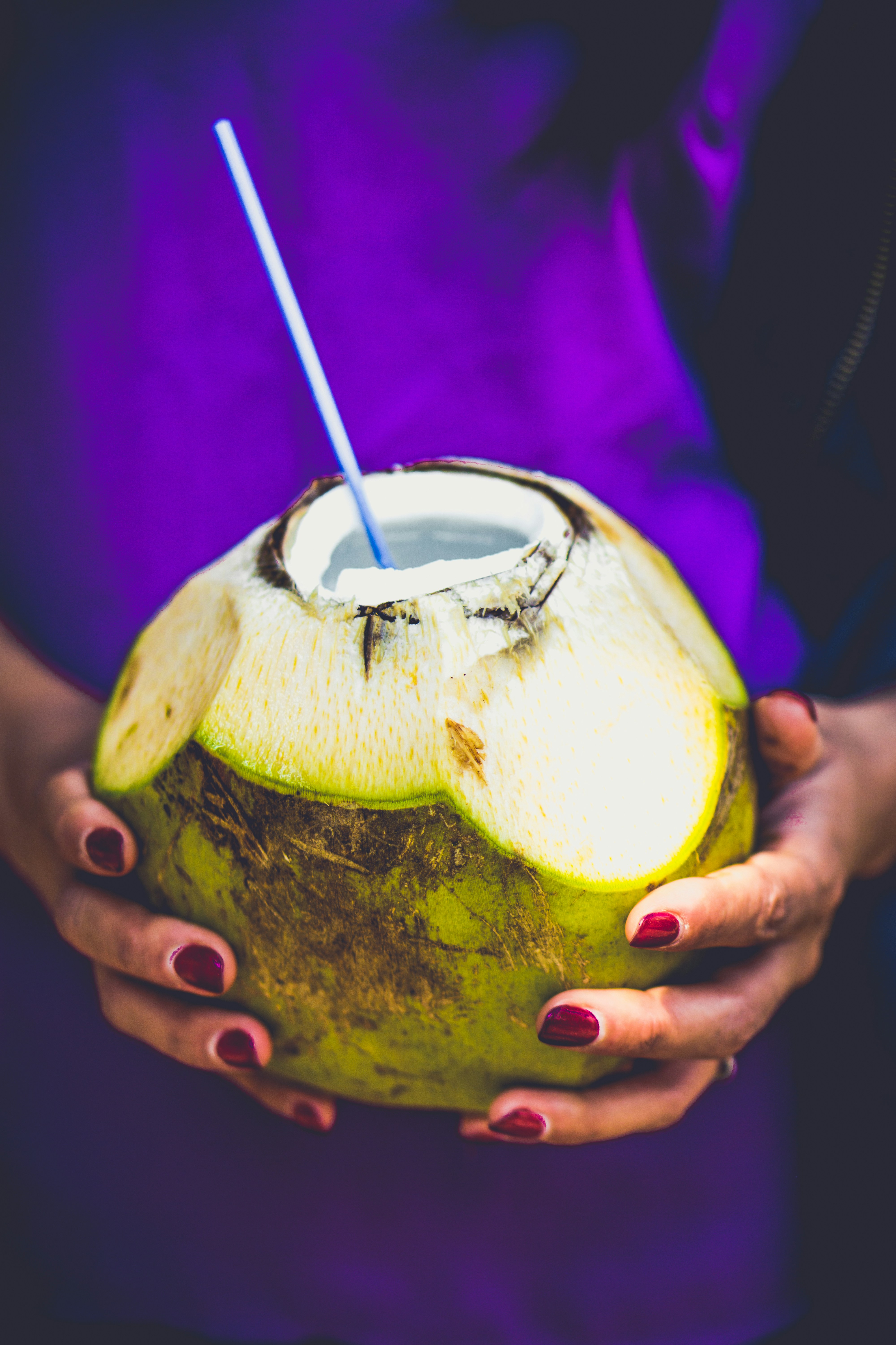 A girl holding a coconut