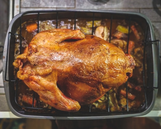 rotisserie chicken on top of grill