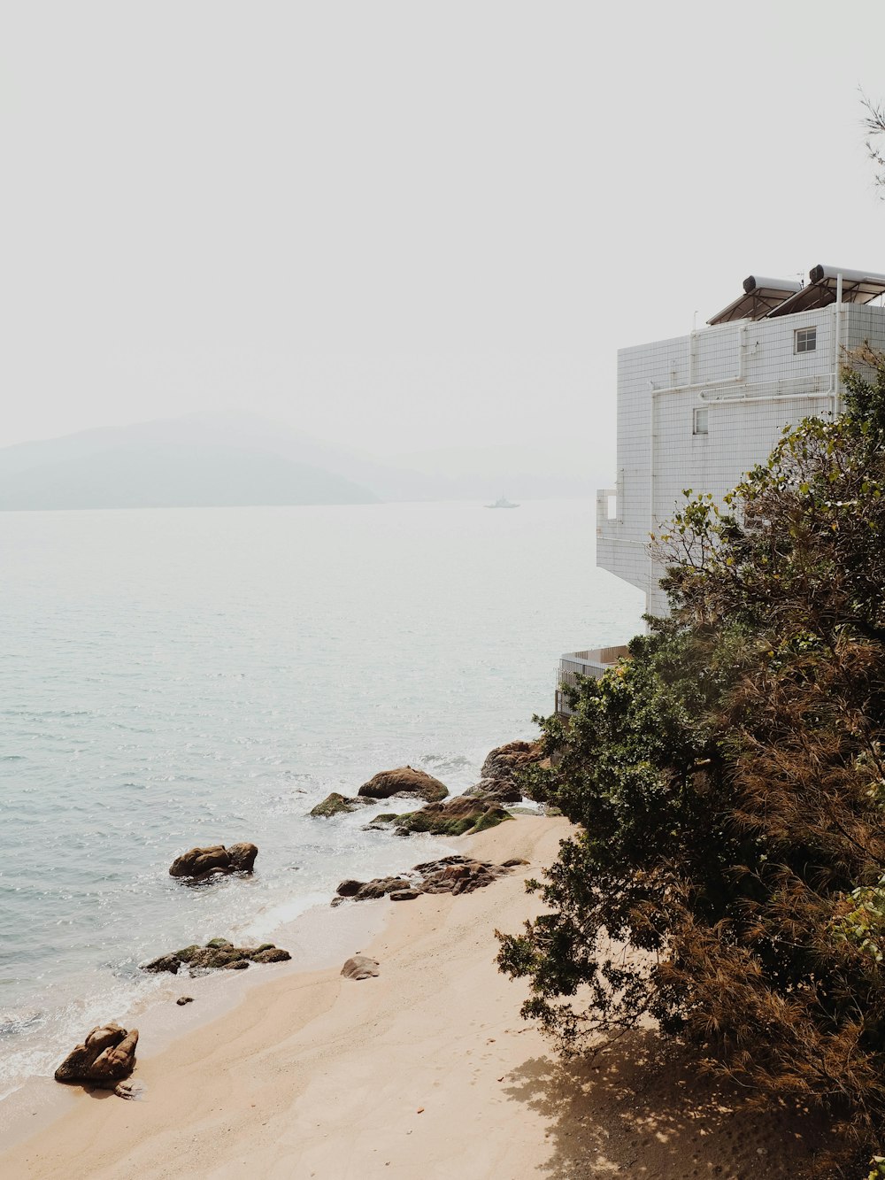 white building near body of water