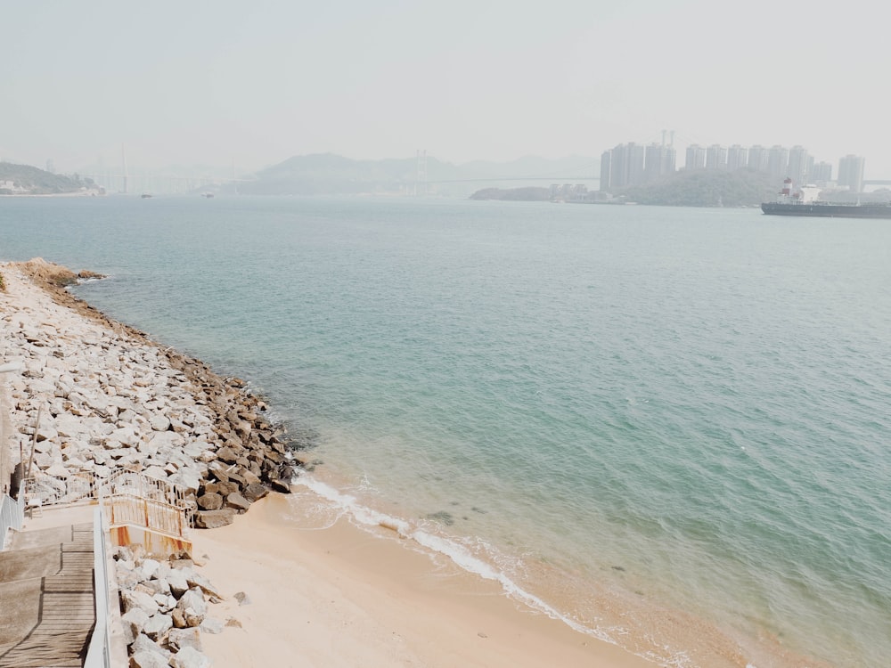 brown rock formation near sea