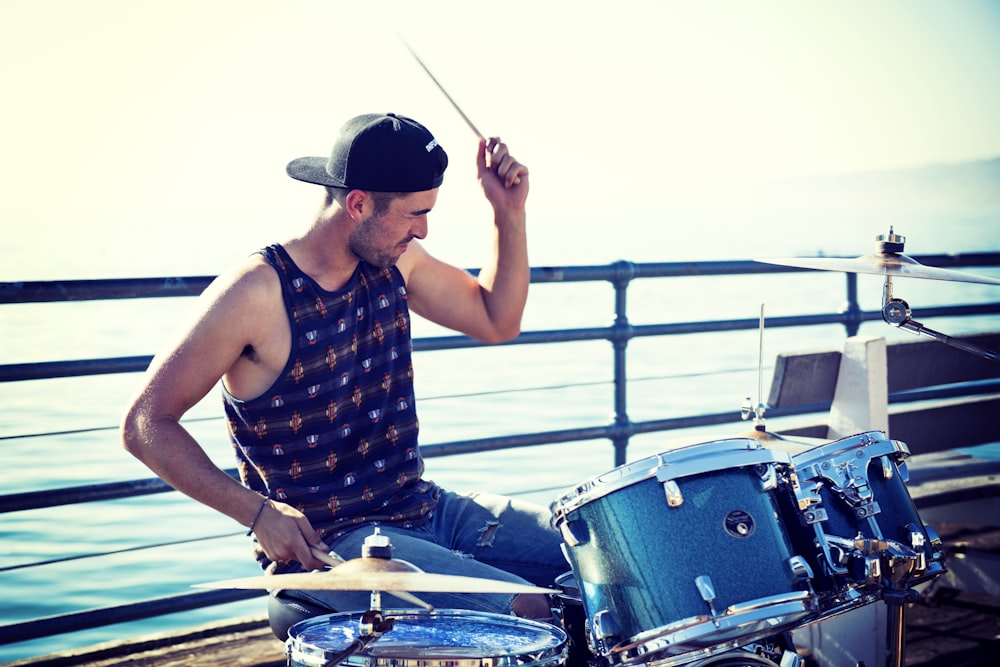 men playing acoustic drum kit