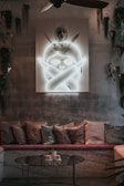 A peaceful living area featuring comfortable seating and art.