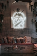 Living area in the suite with a sofa, coffee table, and stylish artwork.