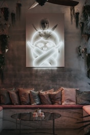 Cozy seating area inside the family suite with plush sofa and tasteful artwork.