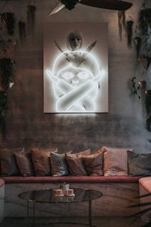 A vibrant living area with unique art pieces and comfortable seating.