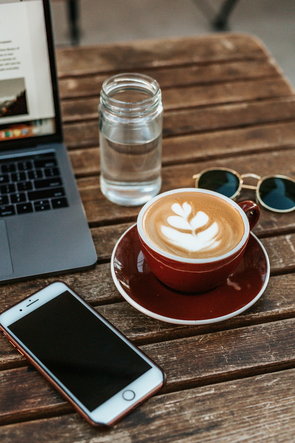 latte served on red ceramic cup