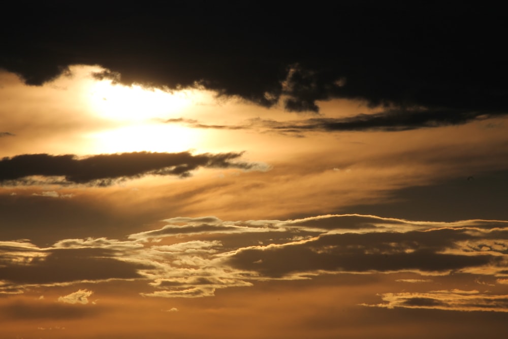 white cloudy sky during golden hour