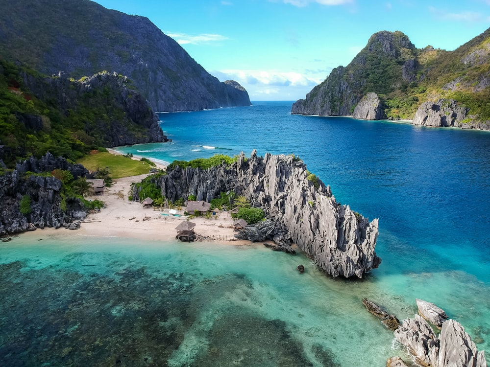 aerial photo of body of water between mountains