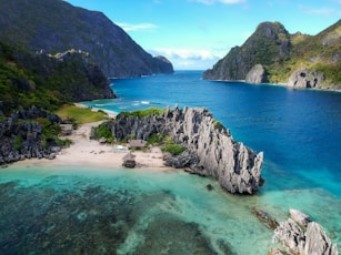 aerial photo of body of water between mountains