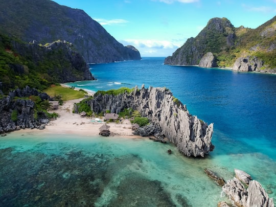 aerial photo of body of water between mountains in El Nido Philippines