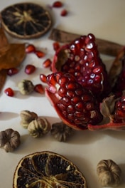 Close-up of glossy, rich dry fruits arranged on a natural fiber cloth.