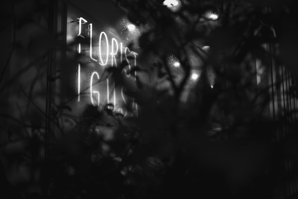 grayscale photo of lighted florist neon light signage