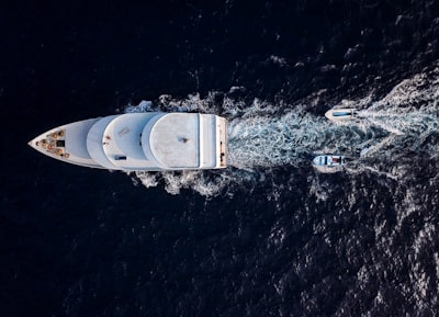 aerial photo of white yacht boat teams background