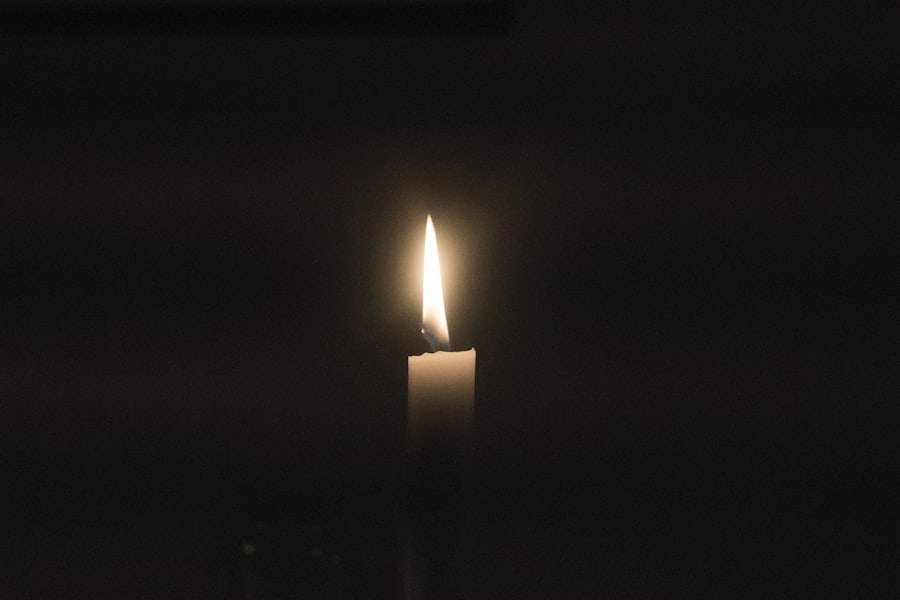 Single lit memorial candle