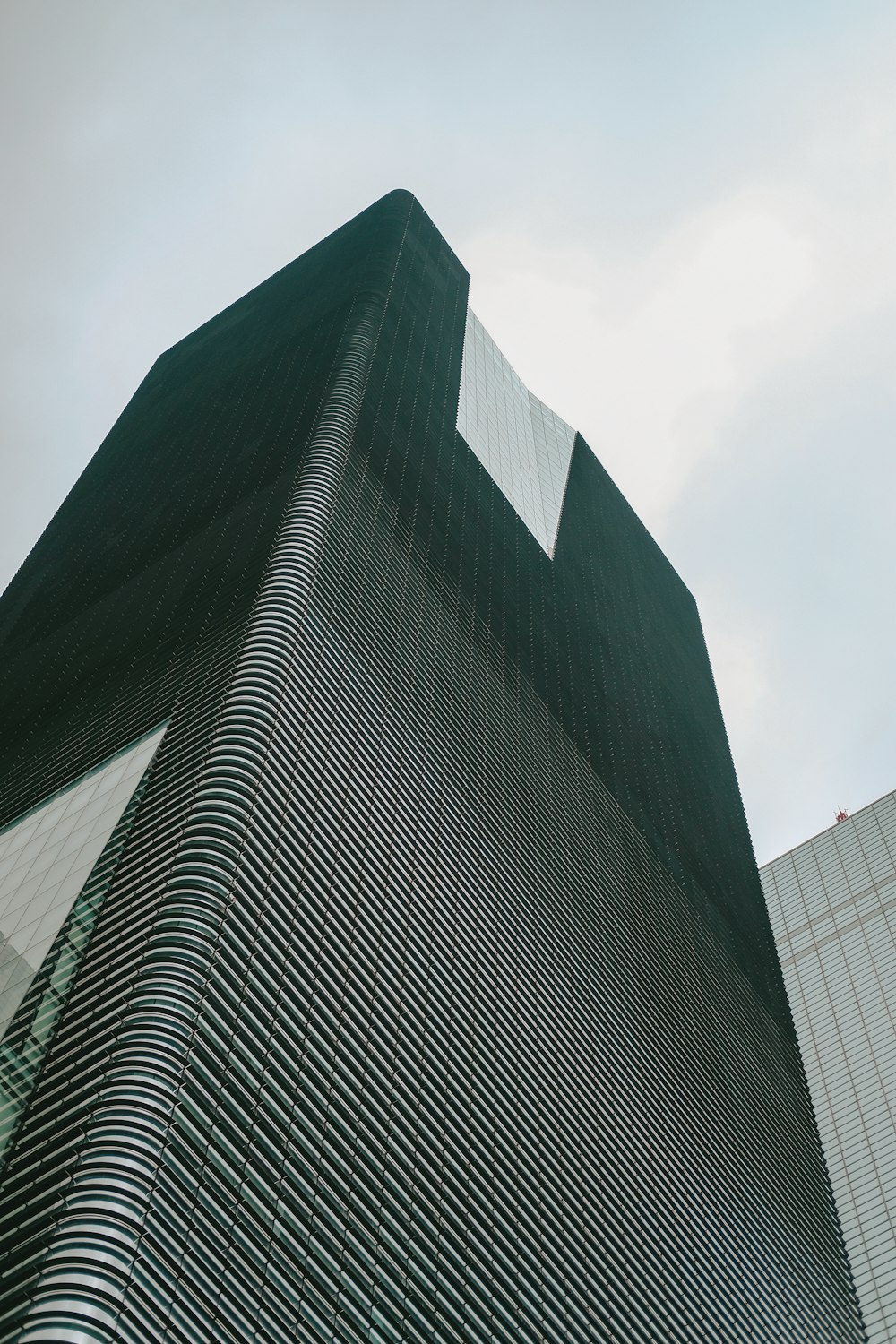 ground shot of black skyscraper