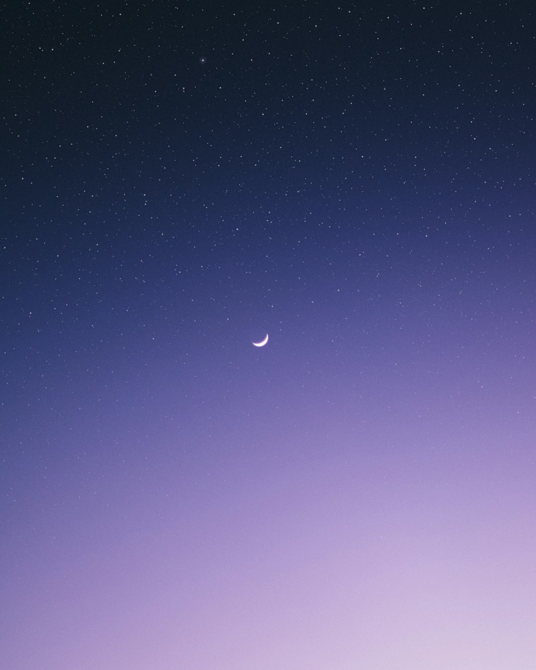 crescent moon surrounded by stars during night time