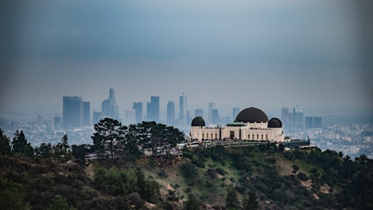 white and black building on mountain m in Griffith Observatory United States