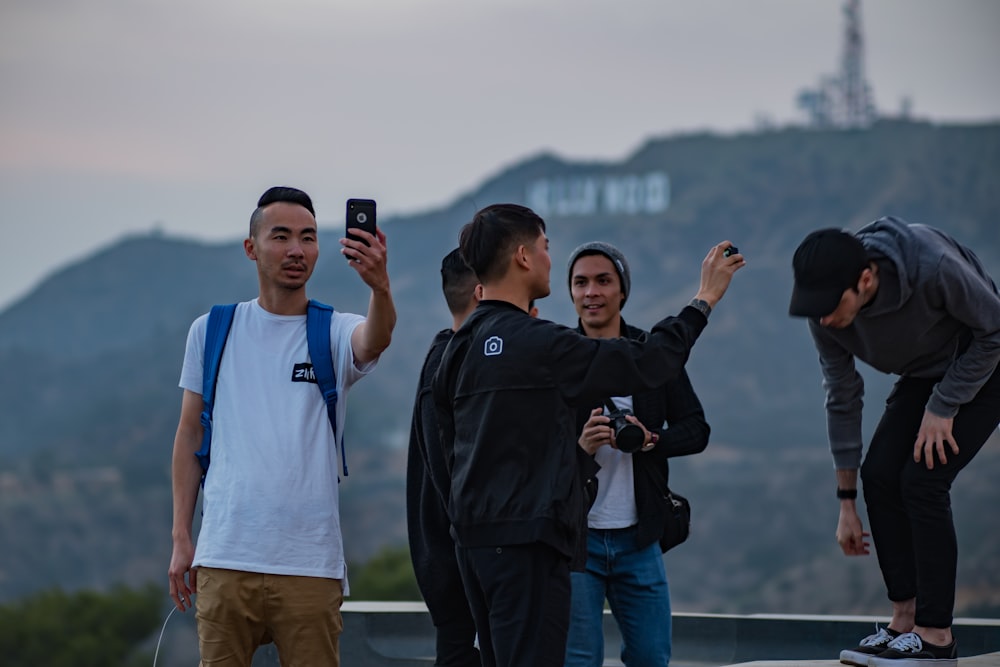 people taking photo on building