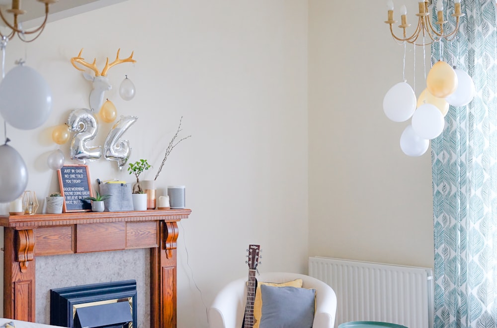 white tub chair near wooden fireplace