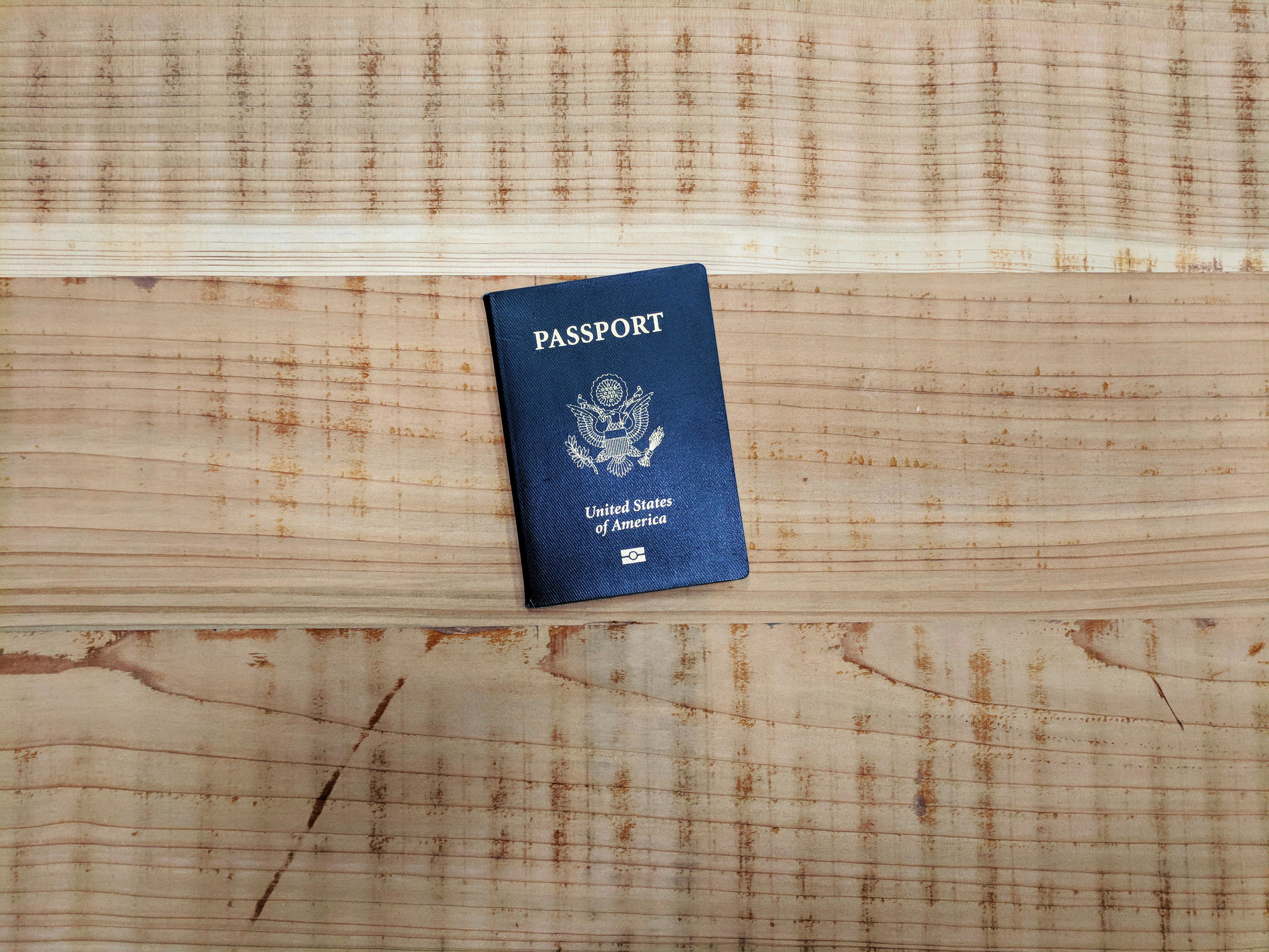 Passport on the floor representing travel readiness and visa preparation