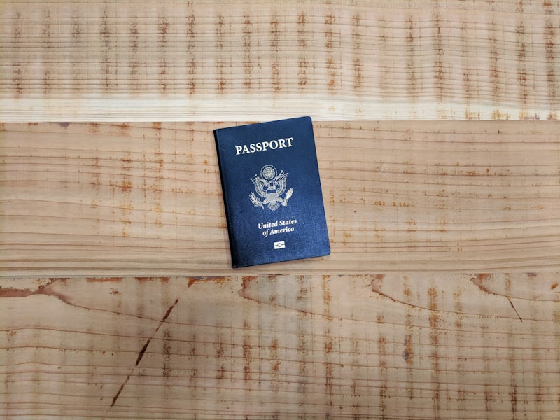 A blue passport open on a textured surface