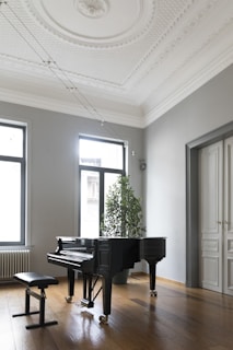 An elegant upright piano in a cozy living room.