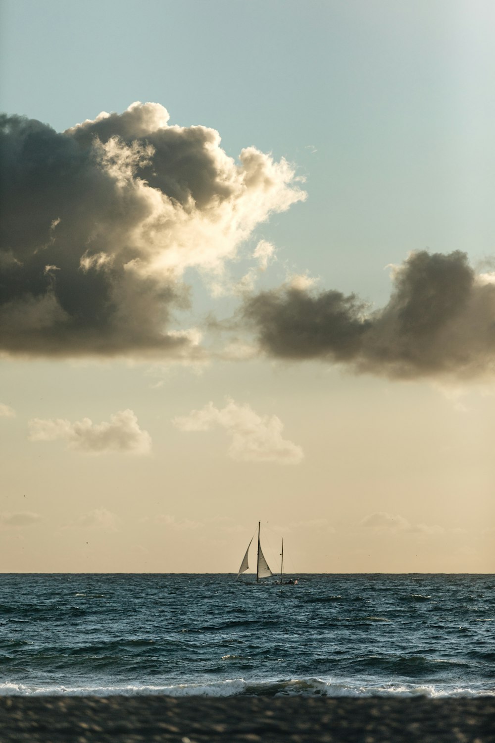 white sail boat