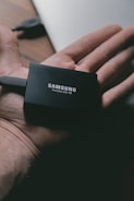 Samsung portable T5 SSD on person's hand