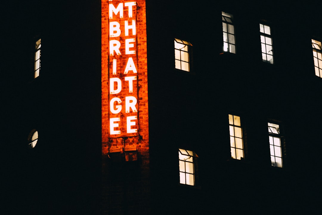 lighted building with signboard
