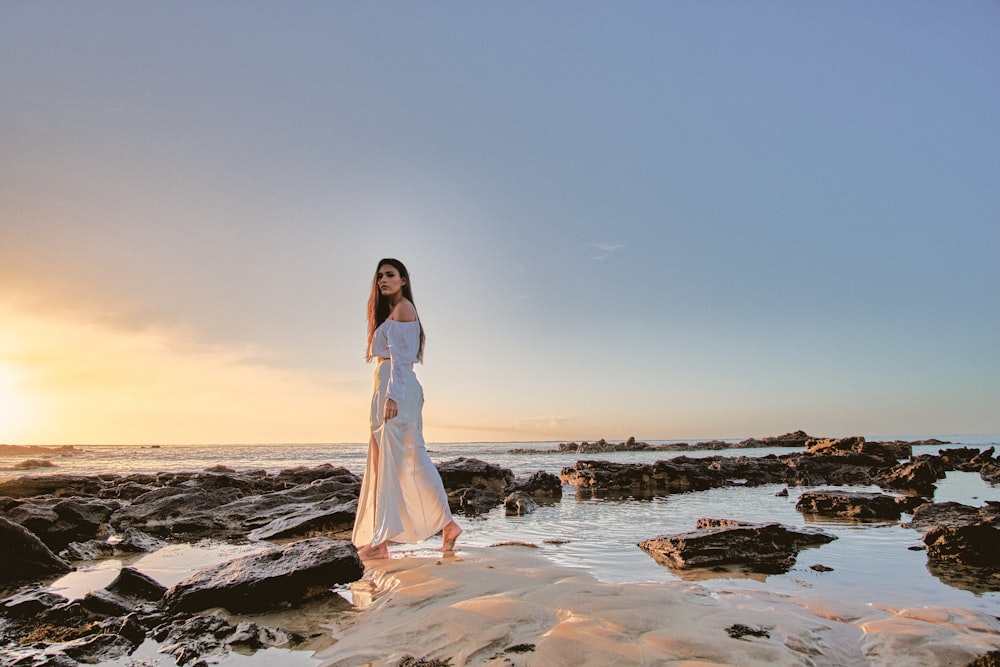 woman standing on body of water