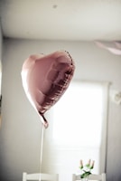 gray balloon on table