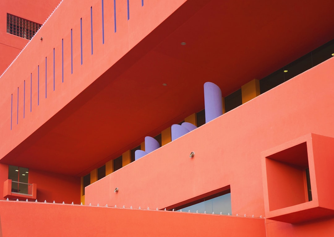 orange wall building closeup photography,