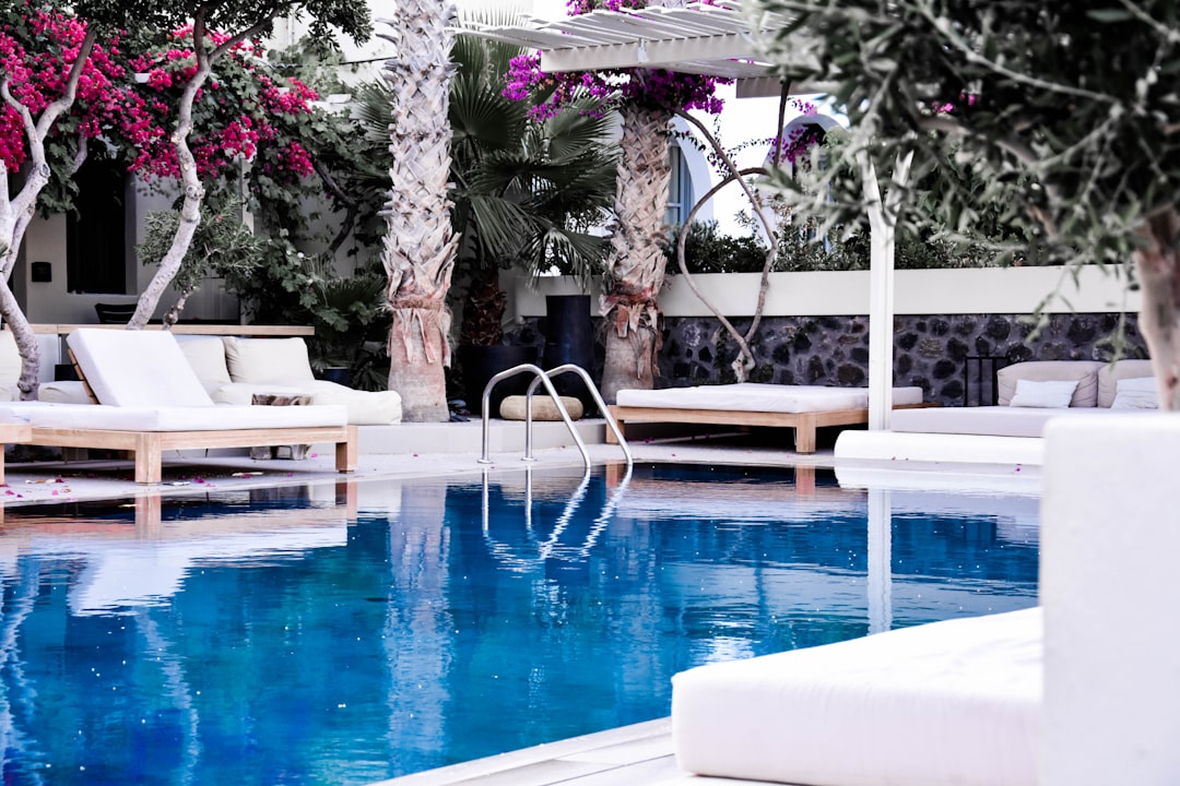 pool surrounded of chairs, Beautiful pool I found while exploring Santorini.