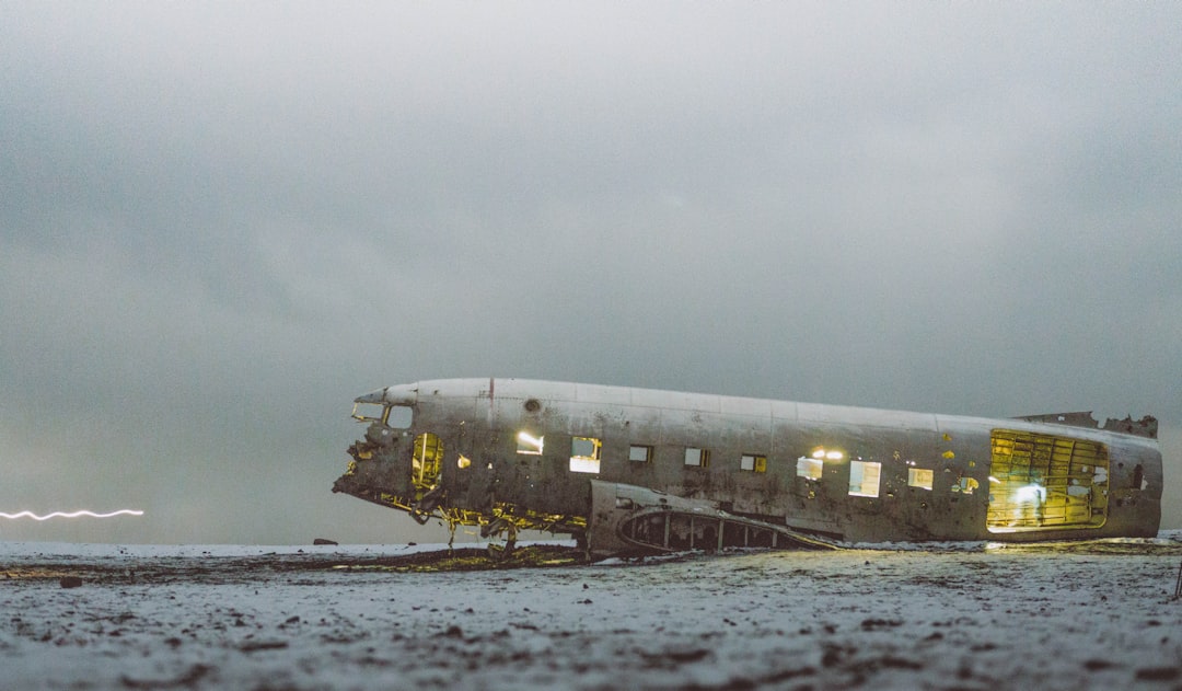abandoned plane under white sky