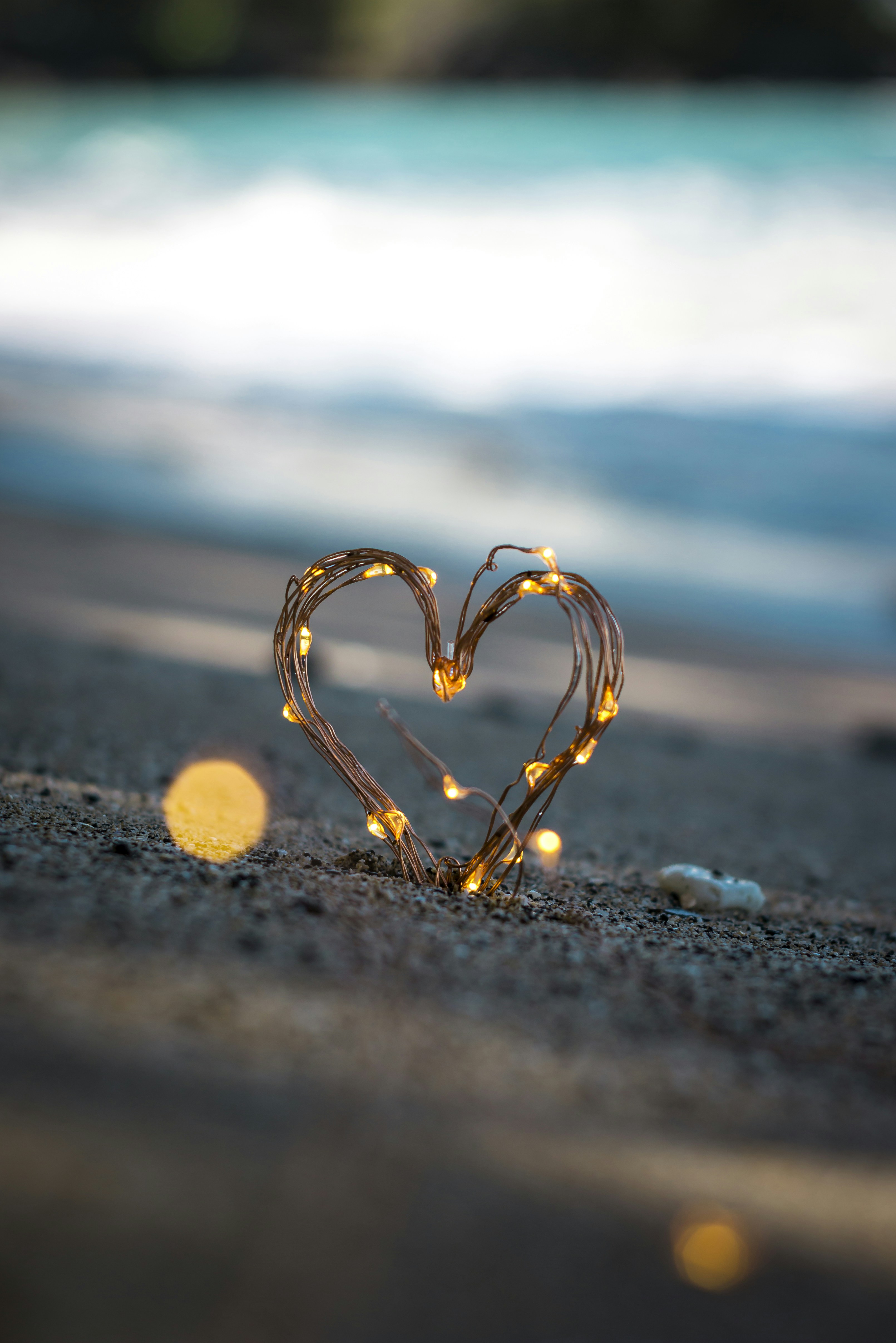 macro photography of heart shape sand decor