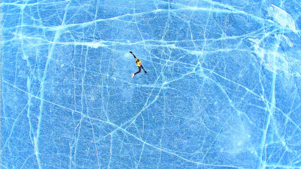 person falling on blue surface