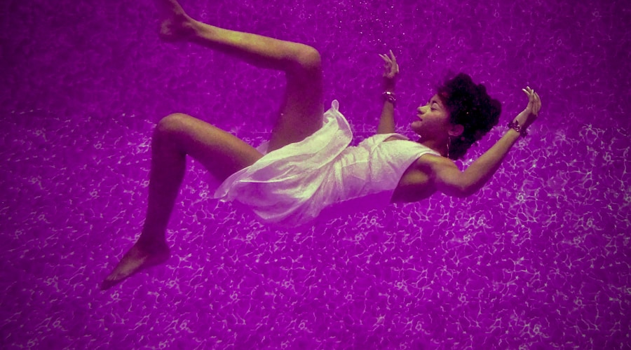 woman falls on purple surface