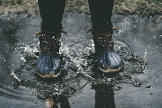 person standing on splashed water