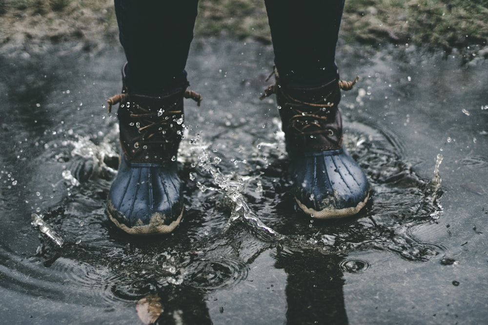 person standing on splashed water