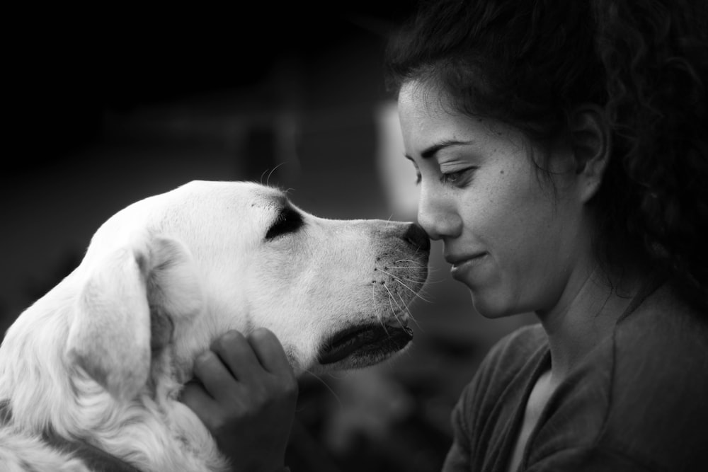 woman kissing the dog